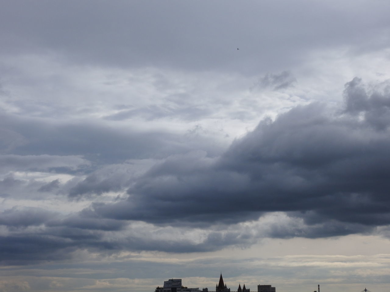 LOW ANGLE VIEW OF SILHOUETTE BUILDINGS AGAINST SKY