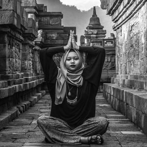 Portrait of woman doing yoga at borobudur