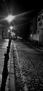 Shadow of man on illuminated city at night