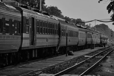 Train at railroad station against clear sky