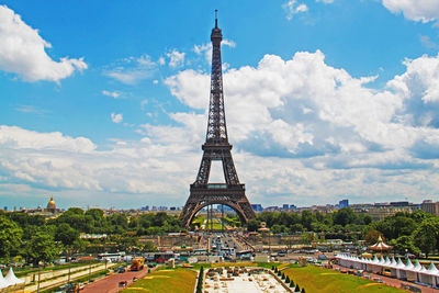 The famous eiffel tower in city of paris against cloudy sky