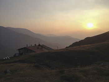 Scenic view of mountains against sky during sunset