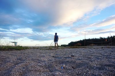 Rear view of man against sky