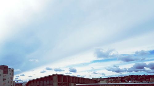 High section of building against cloudy sky