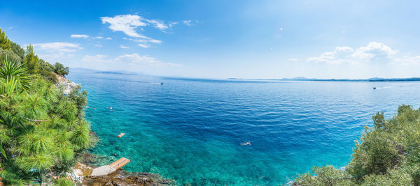 Scenic view of sea against blue sky