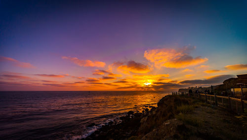 View of sea against cloudy sky during sunset