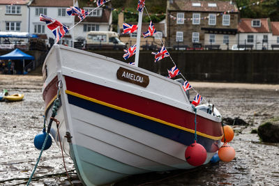 Moored boat against built structures