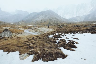 Scenic view of snow covered mountains