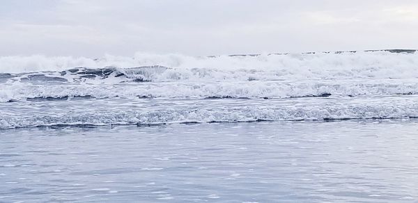 Scenic view of sea against sky during winter