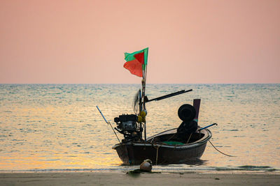 Boat on sea against clear sky