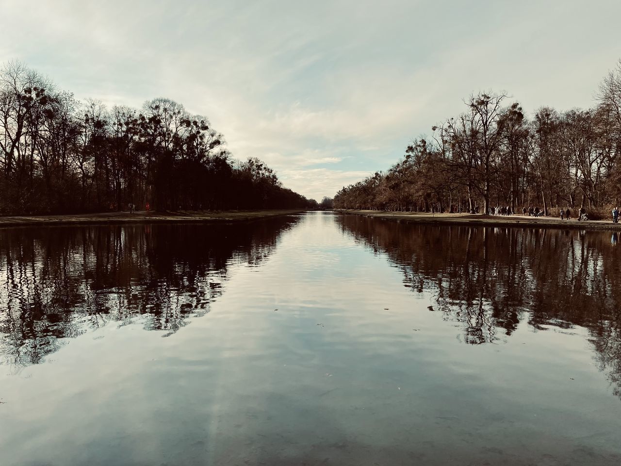 LAKE AMIDST TREES AGAINST SKY