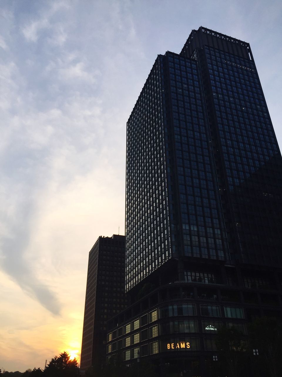 architecture, skyscraper, modern, sky, low angle view, building exterior, built structure, city, sunset, no people, outdoors, day