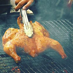Close-up of man preparing food