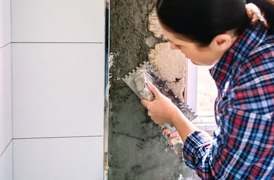 Man working on wall