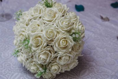 Close-up of white rose on table