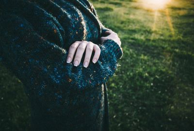 Woman standing on grass