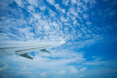 Low angle view of airplane flying in sky