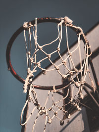 Low angle view of basketball hoop against sky at day