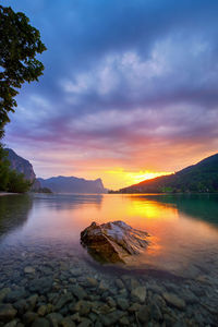 Scenic view of lake against sky during sunset