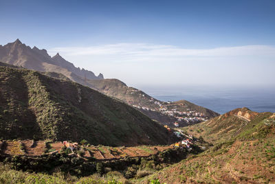 Scenic view of sea and buildings against sky