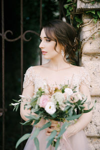 Portrait of bride holding bouquet