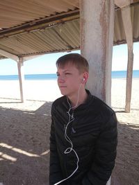 Teenage girl standing on beach