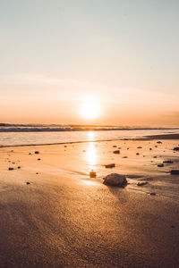 Scenic view of beach during sunset