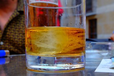 Close-up of beer glass on table