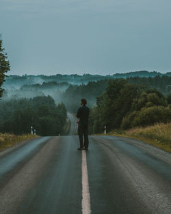 Man on the road after a heavy rain