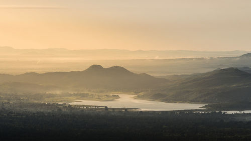 Scenic view of landscape against sky during sunset