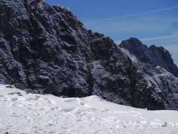 Scenic view of snow covered mountain against sky