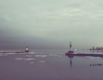 Scenic view of sea against cloudy sky