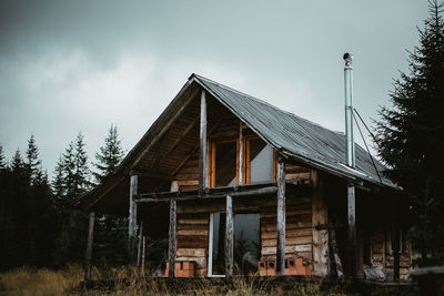 Low angle view of abandoned building against sky