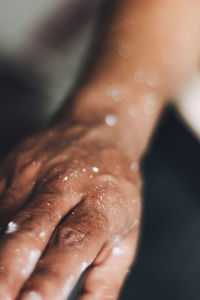 Close-up of man hand with signs of paint