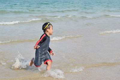 Full length of boy on beach