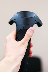 Close-up of hand holding joystick