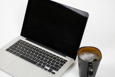 High angle view of coffee cup on table