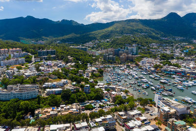 High angle view of townscape and mountains against sky