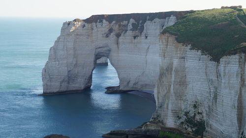 View of rock formations in sea