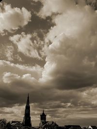 Low angle view of temple against cloudy sky