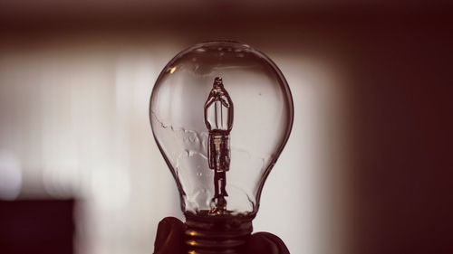 Close-up of illuminated light bulb