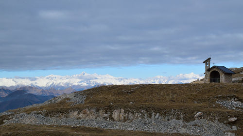 Panoramic view of building and mountains against sky