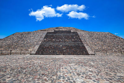 Low angle view of historical building against blue sky