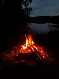 Close-up of bonfire against sky at night