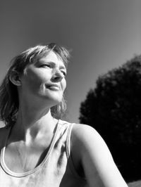 Portrait of a smiling young woman looking away