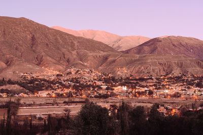 View of city buildings with mountain in background