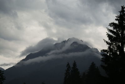 Low angle view of silhouette mountains against sky