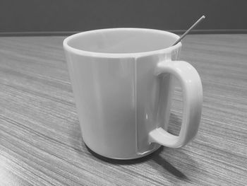 Close-up of coffee cup on table