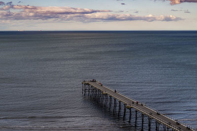 Pier over sea against sky