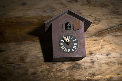 Directly above shot of old telephone booth on table